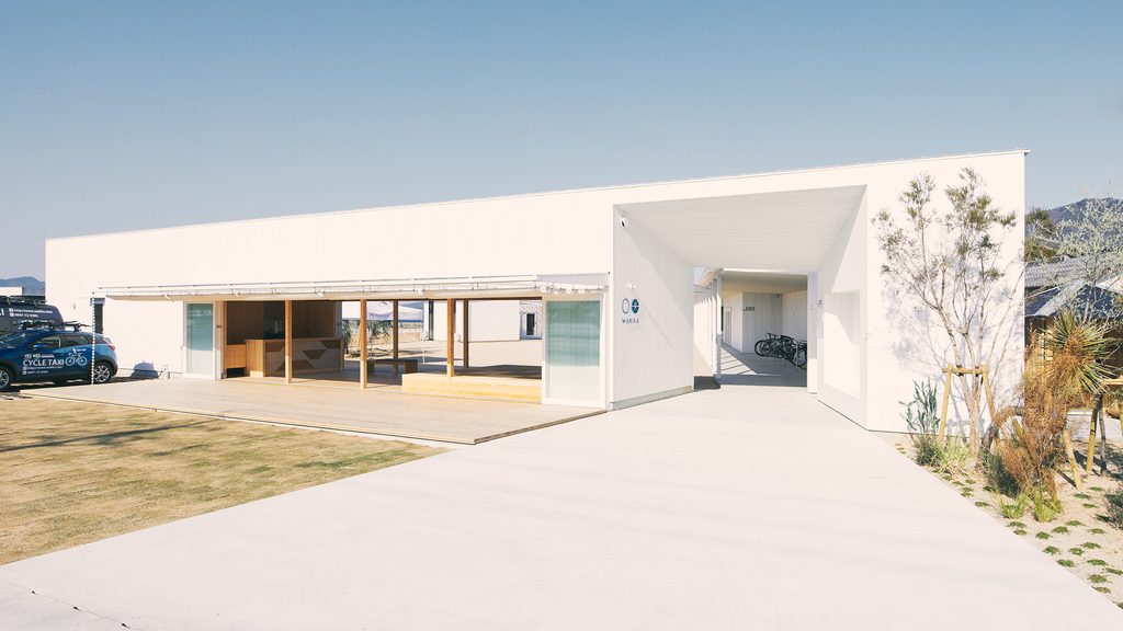 The white, modern exterior of WAKKA on Omishima Island, Japan.
